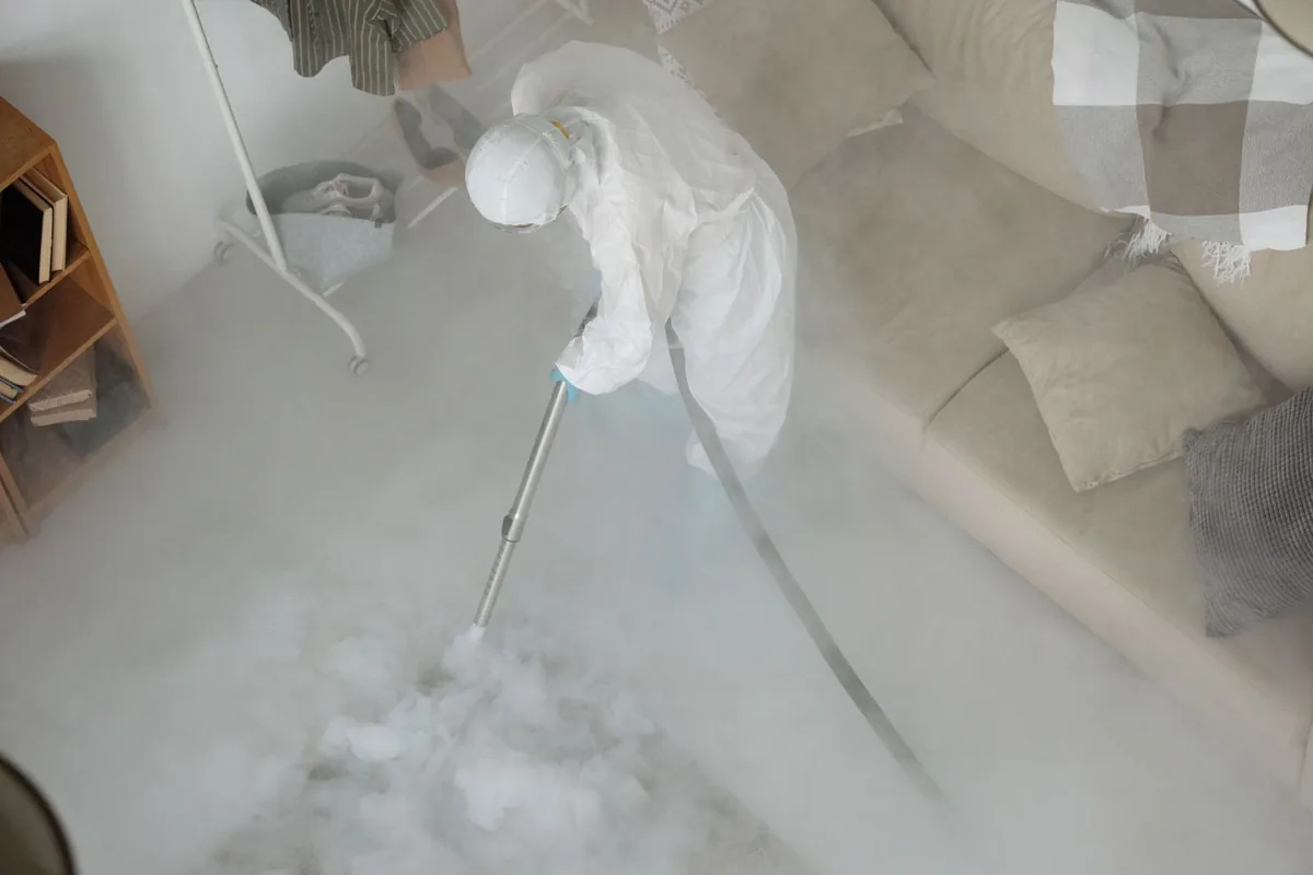 Biohazard cleanup technician in protective equipment, Westlake Corner, VA